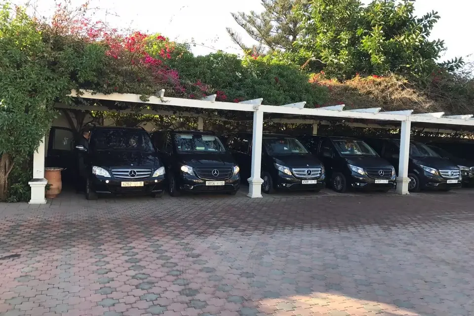 Minivans of MG Taxis Morocco parked and ready for transfers